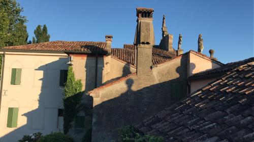 a building with a tower on the side of it at Cà Sagredo in Conselve