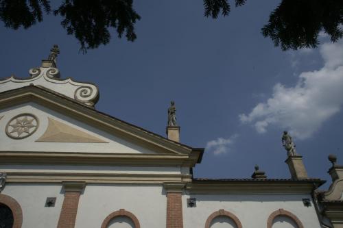 a building with a clock tower on top of it at Cà Sagredo in Conselve