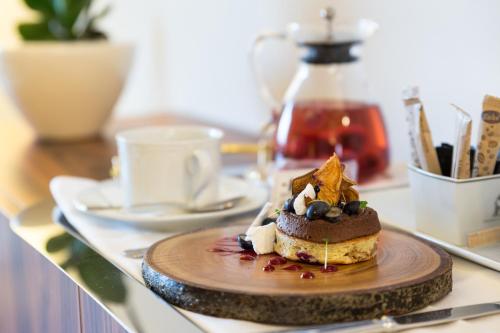 a dessert on a wooden plate on a table at Pousada de Bragança - Sao Bartolomeu in Bragança
