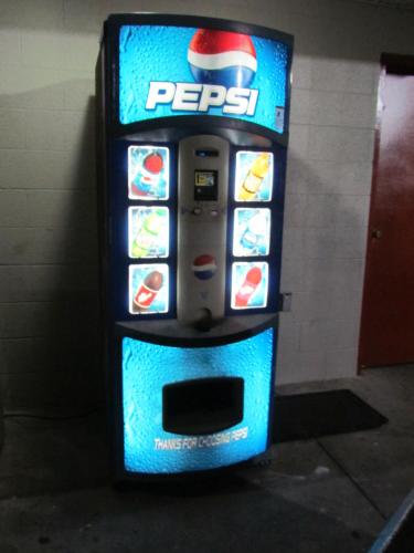 a pepsi vending machine in a building at Red Carpet Inn - Augusta in Augusta