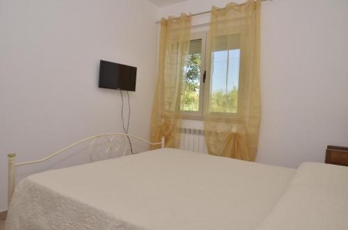 Ένα ή περισσότερα κρεβάτια σε δωμάτιο στο B&B Mero' Room