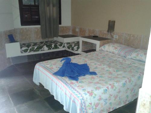 Cama o camas de una habitación en Ilhabela Tênis Clube