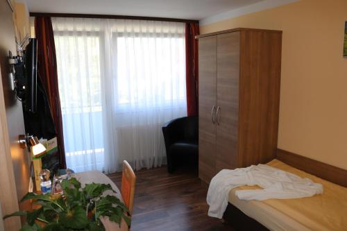 Un ou plusieurs lits dans un hébergement de l'établissement Hotel Brigitte