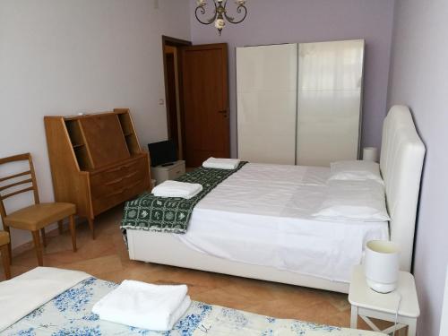 Cama o camas de una habitación en B&B Domus Lupiae