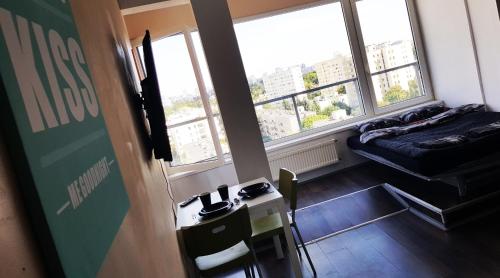 a small room with a bed and a window at Walk distance to mokotow business park in Warsaw
