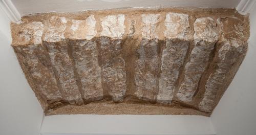 a ceiling of a cave with a rock at Apartment Antea in Sinj