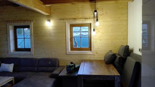 a living room with a couch and a table at Chata Eden in Hrabušice