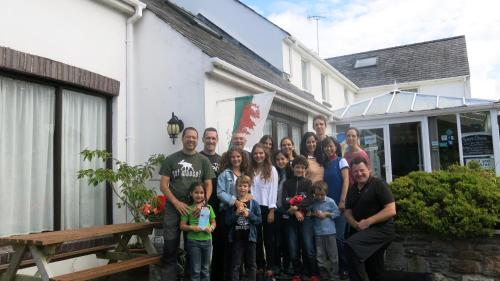 a large group of people posing for a picture at Ivybridge Guesthouse in Fishguard