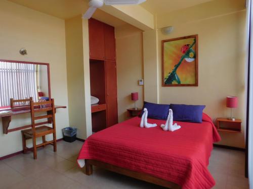 Ένα ή περισσότερα κρεβάτια σε δωμάτιο στο Hotel Florida Oaxaca