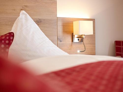 Ένα ή περισσότερα κρεβάτια σε δωμάτιο στο Landhotel Mohren