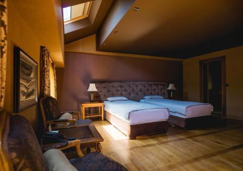 Ένα ή περισσότερα κρεβάτια σε δωμάτιο στο Ventura Boutique Hotel