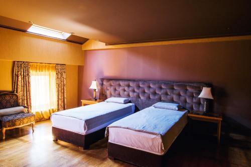 Ένα ή περισσότερα κρεβάτια σε δωμάτιο στο Ventura Boutique Hotel