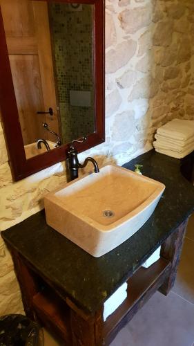 a bathroom sink with a mirror on a counter at Villa Cherie in Sutomišćica
