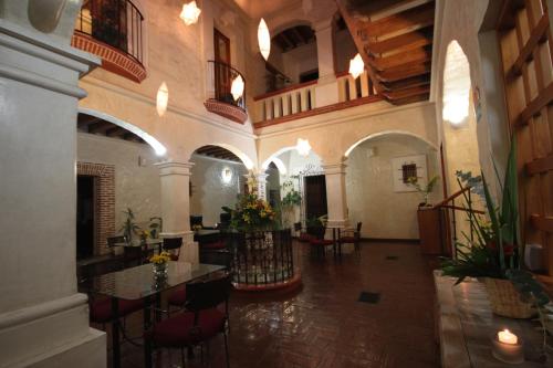 a large room with tables and chairs in a building at Hotel Boutique Casa Catrina in Oaxaca City