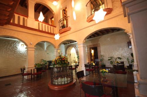 a room with a table and chairs in a building at Hotel Boutique Casa Catrina in Oaxaca City