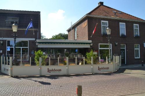 a building with a lot of plants in front of it at Hotel Restaurant Cafe Houben in Nunhem
