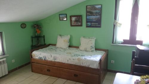 Ένα ή περισσότερα κρεβάτια σε δωμάτιο στο Apartamentos Peña Ubiña