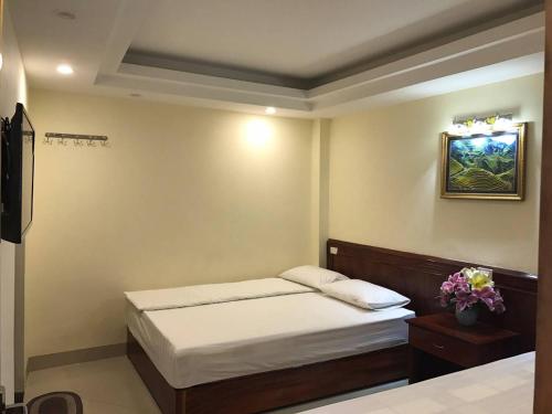 Giường trong phòng chung tại Camellia Guest House