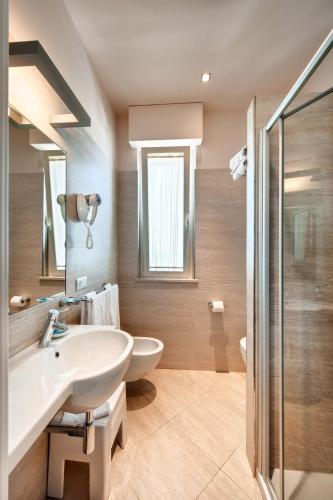 a bathroom with a sink and a shower at Hotel Bahia in San Benedetto del Tronto