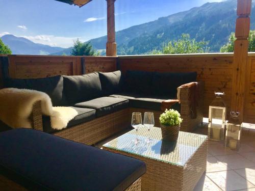 a living room with a couch and a table at Chalet Kaprun in Kaprun