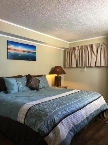 a bedroom with a large bed in a room at Spectacular Oceanview Condos in Myrtle Beach