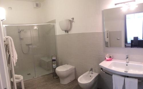 a bathroom with a sink and a toilet and a shower at Hotel Le Mura e Residence in Città di Castello