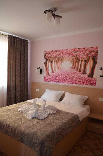 Un pat sau paturi într-o cameră la Vila Danly