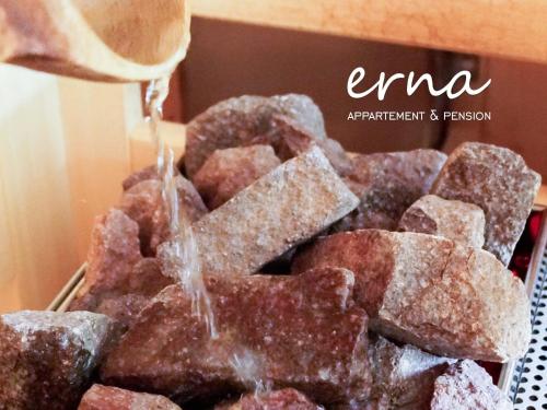 a box of donuts are being drizzled with icing at Pension Apartment Erna in Resia
