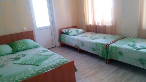Кровать или кровати в номере Guest House on Abazgaa 30