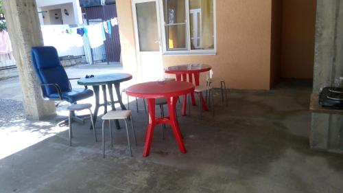 a group of tables and chairs in a room at Guest House on Abazgaa 30 in Gagra