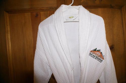 a white sweater is hanging on a wall at Alpenglow Bed and Breakfast in Kimberley