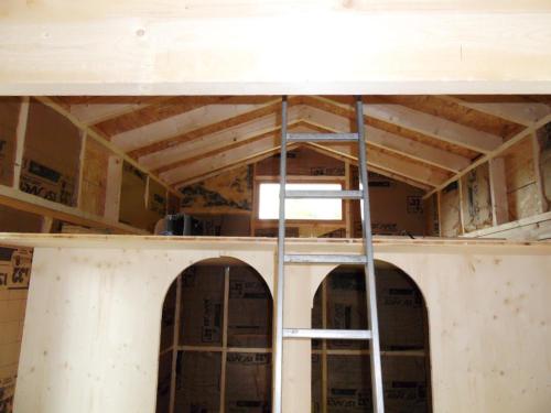 a room with a ceiling with a ladder in it at La roulotte du bucheron in Lapoutroie
