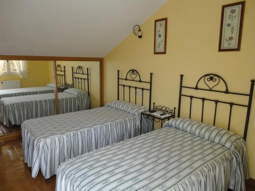 Postel nebo postele na pokoji v ubytování Casa Os Batans