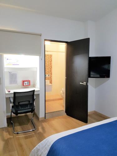 Televisyen dan/atau pusat hiburan di Hotel San Jeronimo Armenia