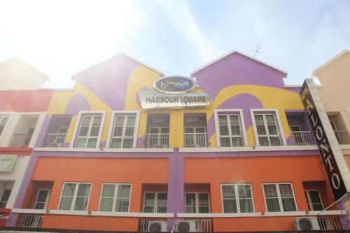 a colorful building with a sign on it at Alonto Hotel in Sandakan
