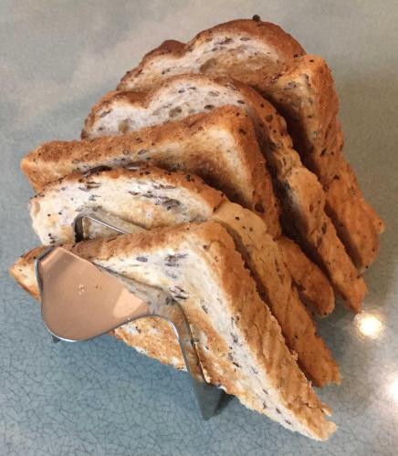 a pile ofasted bread sitting on a table at Hudsons Guest House - Adults only in Weymouth