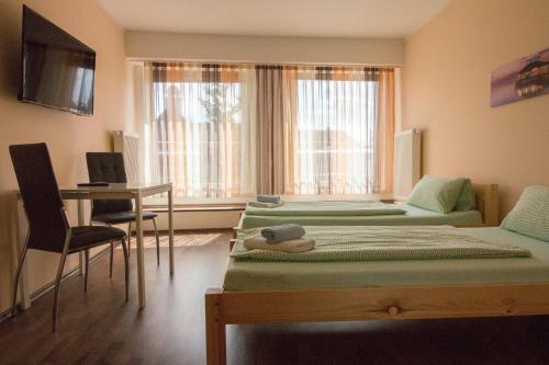 TV a/nebo společenská místnost v ubytování City Apartments Herne