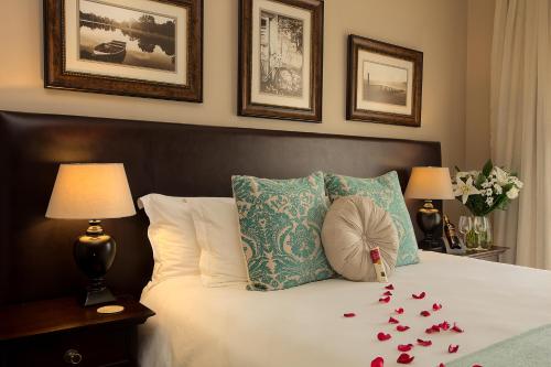 a bedroom with a bed with a bunch of hearts on it at Leopardsong Manor in Centurion