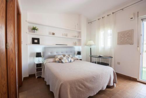 En eller flere senge i et værelse på APN Rio Darro