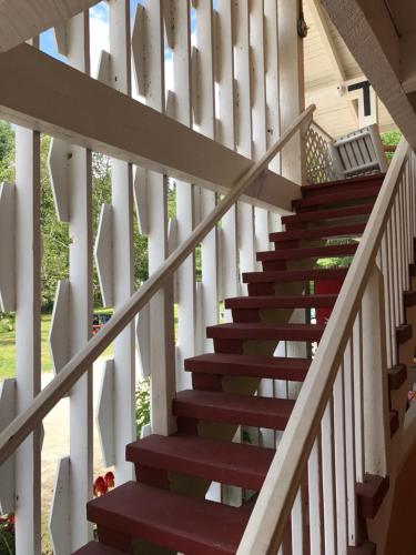 a staircase in a house with red and green steps at Snowdon Chalet Motel in Londonderry
