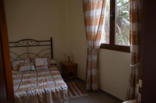 מיטה או מיטות בחדר ב-Casa Camilo