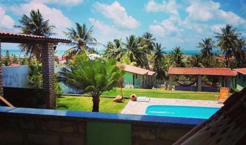 a view of a resort with a swimming pool at Pousada Cruzeiro dos Anjos in Tabatinga