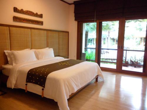 Ліжко або ліжка в номері VC@Suanpaak Boutique Hotel & Service Apartment