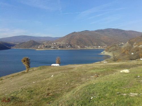 a view of a large body of water with a mountain at Apartment Pavlovic in Soko Banja