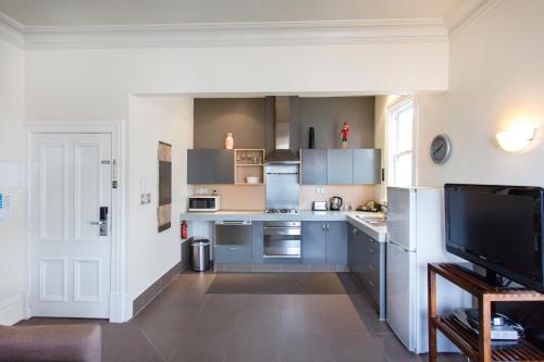 Кухня или кухненски бокс в The Terrace Villas Serviced Apartments