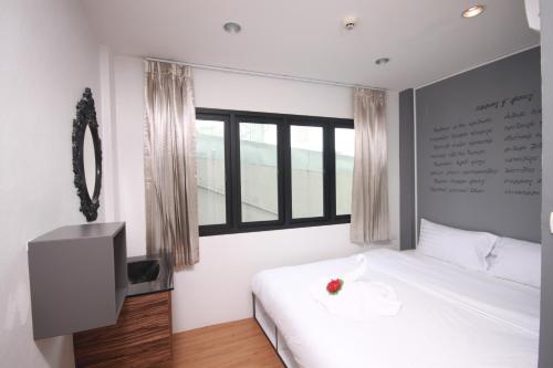 Tempat tidur dalam kamar di Darin Hostel