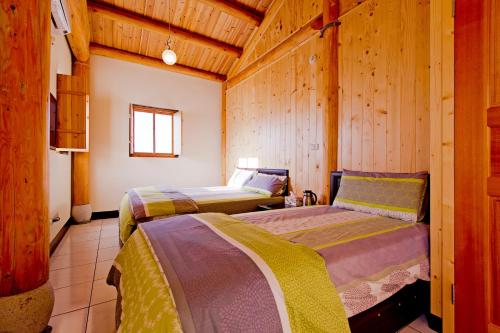 Ένα ή περισσότερα κρεβάτια σε δωμάτιο στο Machigo