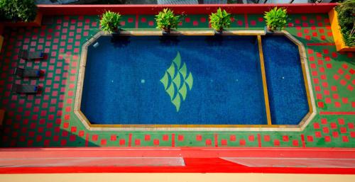 a swimming pool with plants on top of it at Tongtara Riverview Hotel in Bangkok