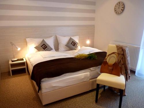 A bed or beds in a room at Hotel Blie, Bed & Breakfast, Self Check-in