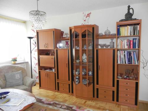 a large wooden book shelf in a living room at Ferienunterkuenfte Schulz in Ahlbeck